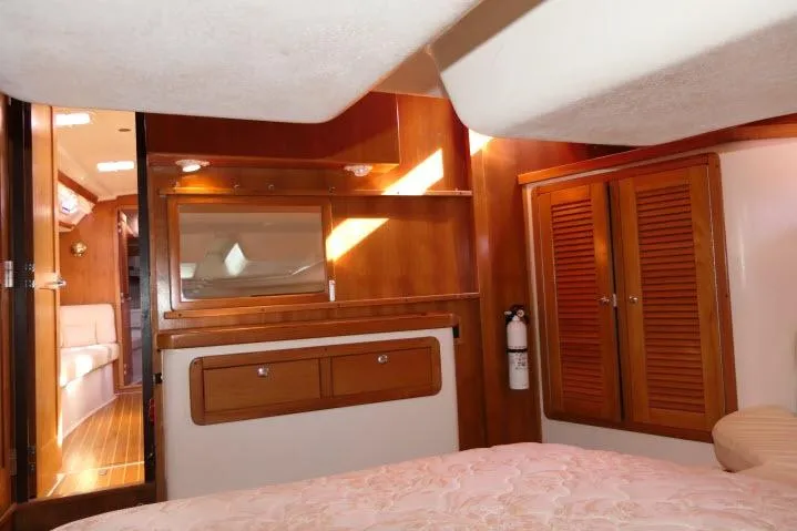 Right Action Yacht Photos Pics Interior of 2008 Catalina 400 MK II yacht with wooden cabinetry and cozy furnishings.
