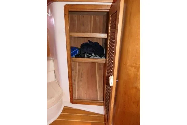 Right Action Yacht Photos Pics Wooden storage cabinet inside 2008 Catalina 400 MK II sailboat interior.