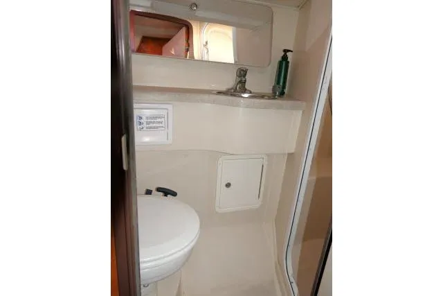 Right Action Yacht Photos Pics 2008 Catalina 400 MK II yacht bathroom with sink, mirror, and toilet.