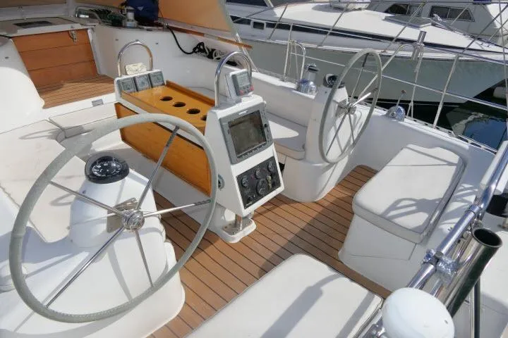 Right Action Yacht Photos Pics 2008 Catalina 400 MK II yacht cockpit with dual steering wheels and navigation equipment.