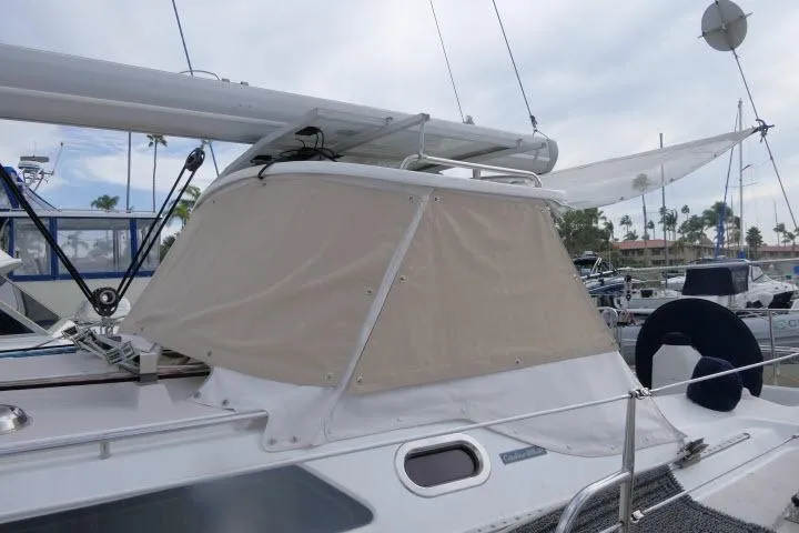 Right Action Yacht Photos Pics 2008 Catalina 400 MK II sailboat with beige canvas cover in marina setting.