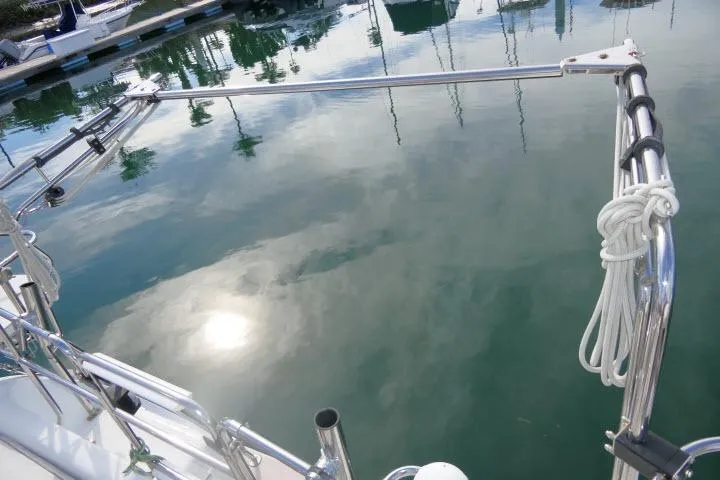 Right Action Yacht Photos Pics Catalina 400 MK II sailboat, 2008 model, docked with calm water reflection.