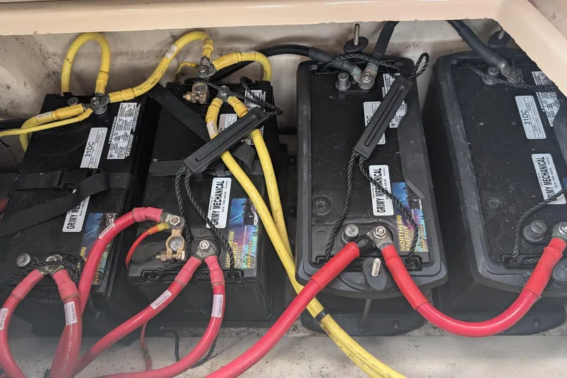 Kameleon Yacht Photos Pics Battery compartment of a 2017 Cutwater C28 boat with connected cables.