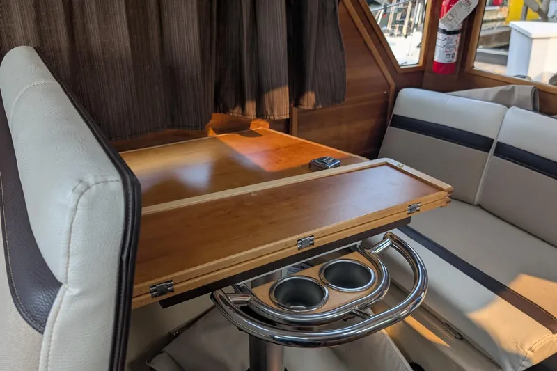 Kameleon Yacht Photos Pics Interior of 2017 Cutwater C28 boat with seating and foldable table.