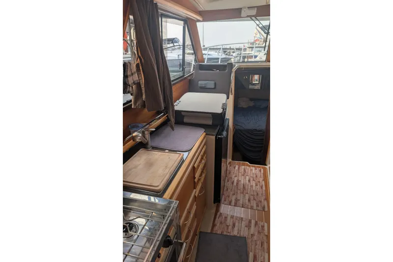 Kameleon Yacht Photos Pics Interior of 2017 Cutwater C28 boat with kitchen and sleeping area.