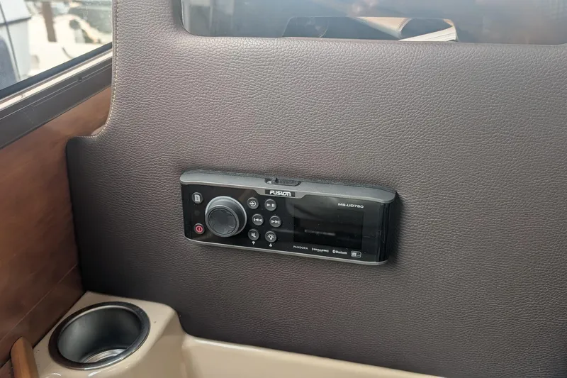 Kameleon Yacht Photos Pics Fusion stereo system in 2017 Cutwater C28 boat interior, mounted on brown panel.