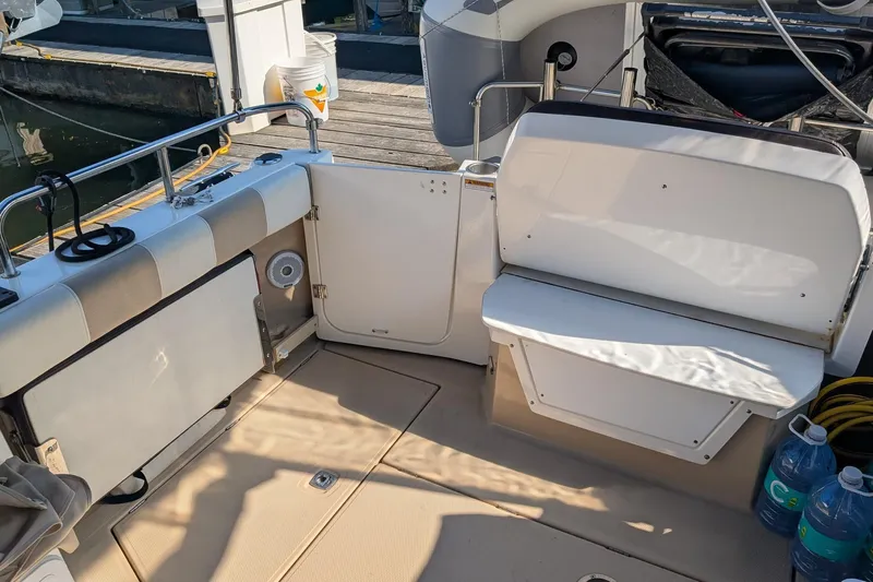Kameleon Yacht Photos Pics 2017 Cutwater C28 boat interior with seating and storage, docked at marina.