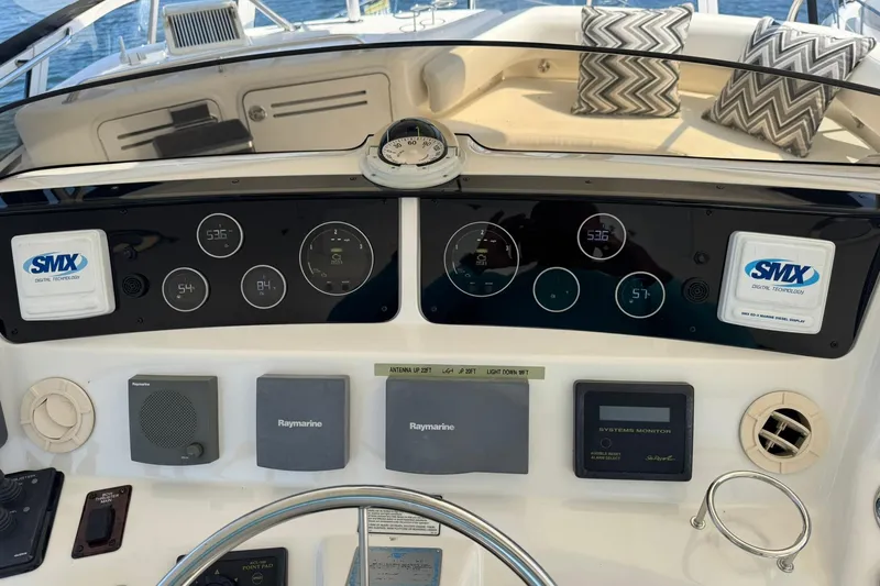  Yacht Photos Pics 2003 Sea Ray 480 Sedan Bridge dashboard with navigation and control systems, featuring Raymarine technology.