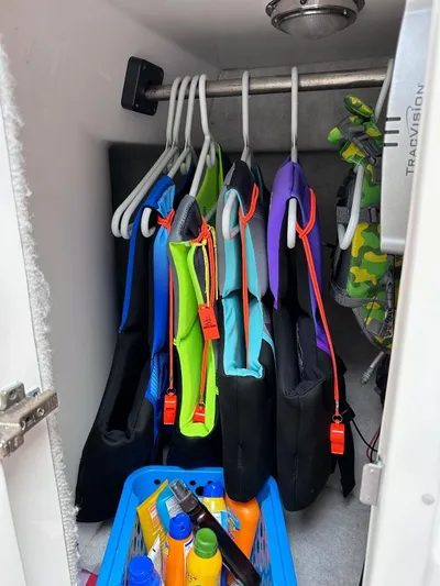 No Name Yacht Photos Pics Life jackets and sunscreen in storage on a 2016 Intrepid 375 Walkaround boat.