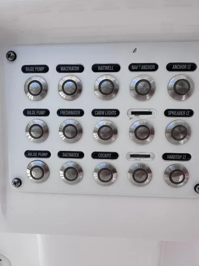 No Name Yacht Photos Pics Control panel of a 2016 Intrepid 375 Walkaround boat with labeled buttons.