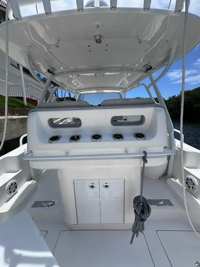 No Name Yacht Photos Pics 2016 Intrepid 375 Walkaround boat interior with fishing rod holders and storage compartments.