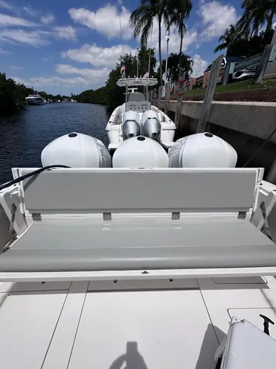 No Name Yacht Photos Pics 2016 Intrepid 375 Walkaround boat with triple outboard engines docked by a canal.