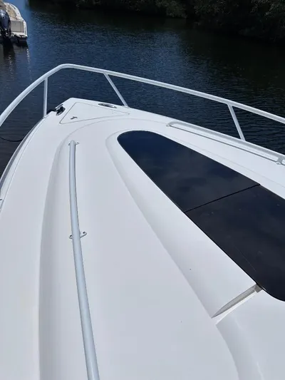 No Name Yacht Photos Pics 2016 Intrepid 375 Walkaround boat deck on calm water.