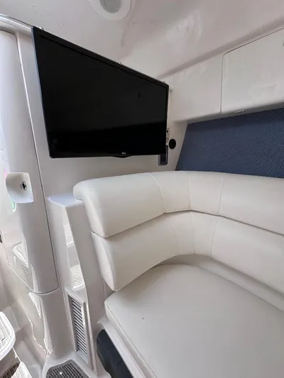 No Name Yacht Photos Pics 2016 Intrepid 375 Walkaround interior with TV and white leather seating.