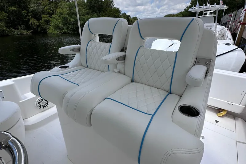 No Name Yacht Photos Pics Luxurious seating on a 2016 Intrepid 375 Walkaround boat with quilted upholstery and cup holders.