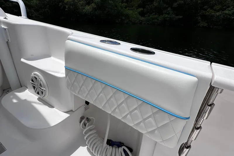 No Name Yacht Photos Pics 2016 Intrepid 375 Walkaround boat interior with cushioned seating and cup holders.