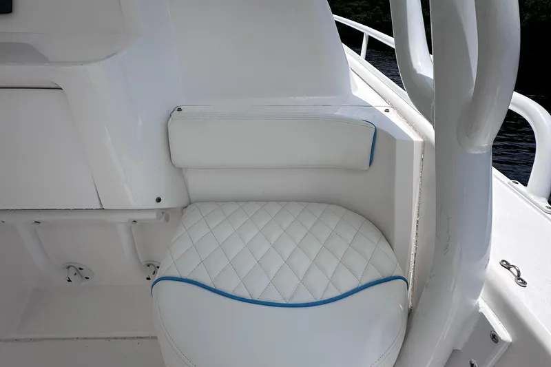No Name Yacht Photos Pics White quilted seat on 2016 Intrepid 375 Walkaround boat, featuring blue trim accents.