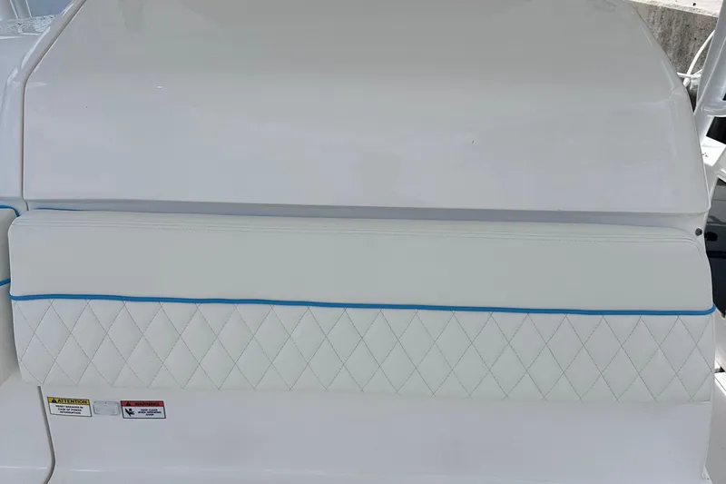 No Name Yacht Photos Pics 2016 Intrepid 375 Walkaround boat seat with white diamond stitching and blue trim.