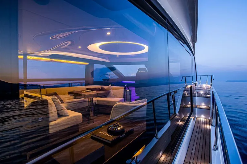 Absolute 52 Fly Yacht Photos Pics Luxurious 2025 Absolute 52 FLY yacht with elegant interior and ocean view at sunset.