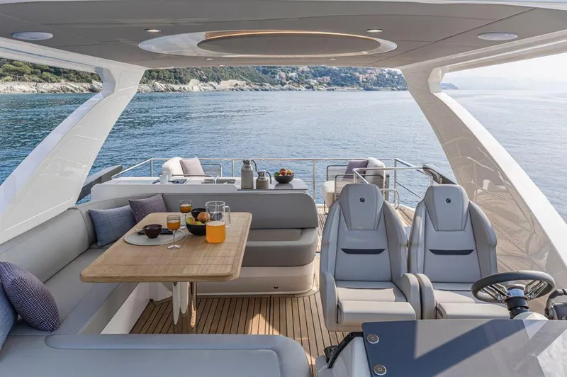 Absolute 52 Fly Yacht Photos Pics Luxurious 2025 Absolute 52 FLY yacht interior with dining area and ocean view.