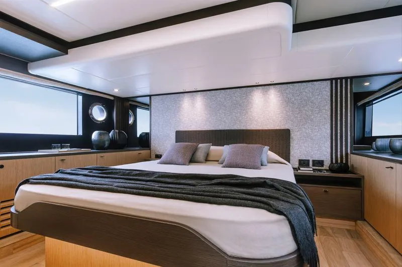 Absolute 52 Fly Yacht Photos Pics Luxurious bedroom interior of 2025 Absolute 52 FLY yacht, featuring modern design and elegant decor.