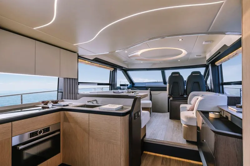 Absolute 52 Fly Yacht Photos Pics Luxurious interior of 2025 Absolute 52 FLY yacht with modern design and panoramic windows.