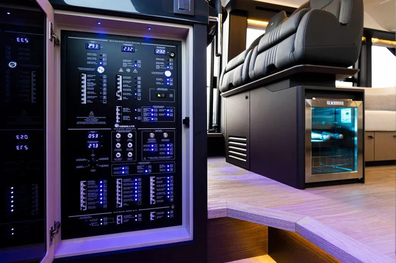 Absolute 52 Fly Yacht Photos Pics Control panel and seating area inside a 2025 Absolute 52 FLY yacht.