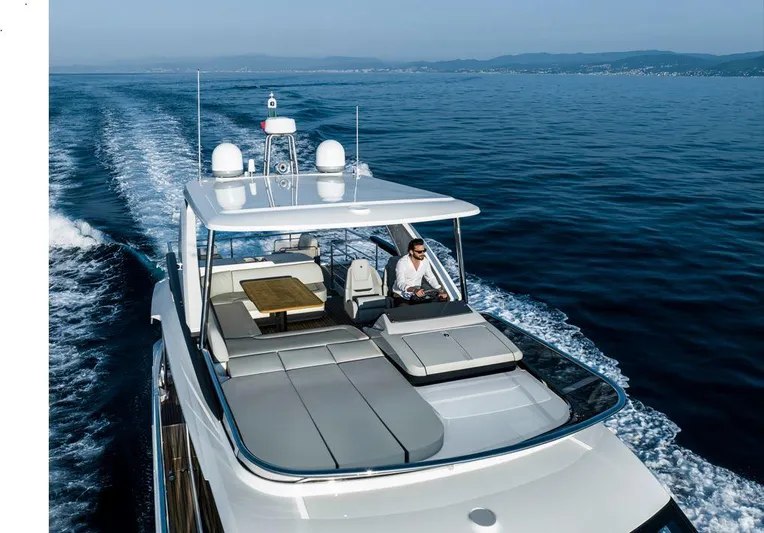 Absolute 52 Fly Yacht Photos Pics 2025 Absolute 52 FLY yacht cruising on open water, featuring spacious deck and modern design.