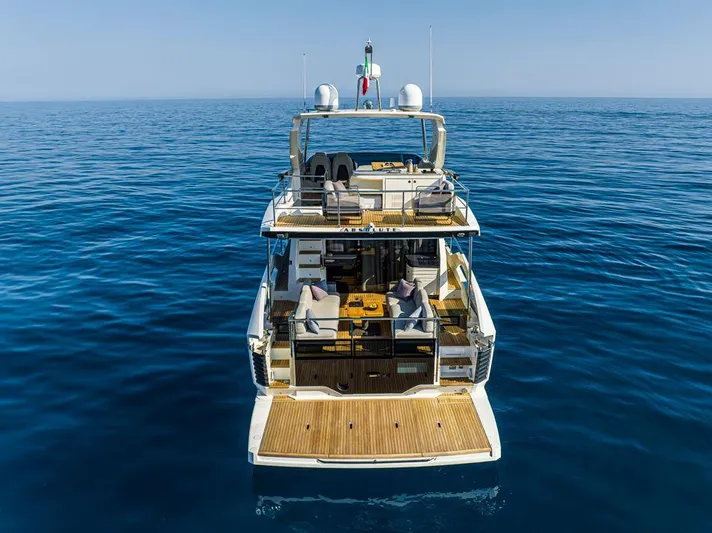 Absolute 52 Fly Yacht Photos Pics Luxury Absolute 52 FLY yacht, 2025 model, cruising on calm blue ocean waters.