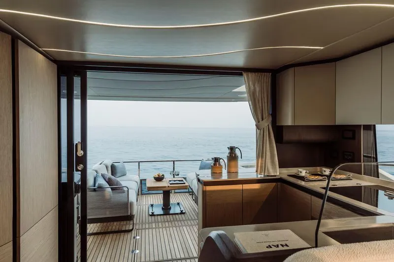 Absolute 52 Fly Yacht Photos Pics Luxurious interior of 2025 Absolute 52 FLY yacht with ocean view.