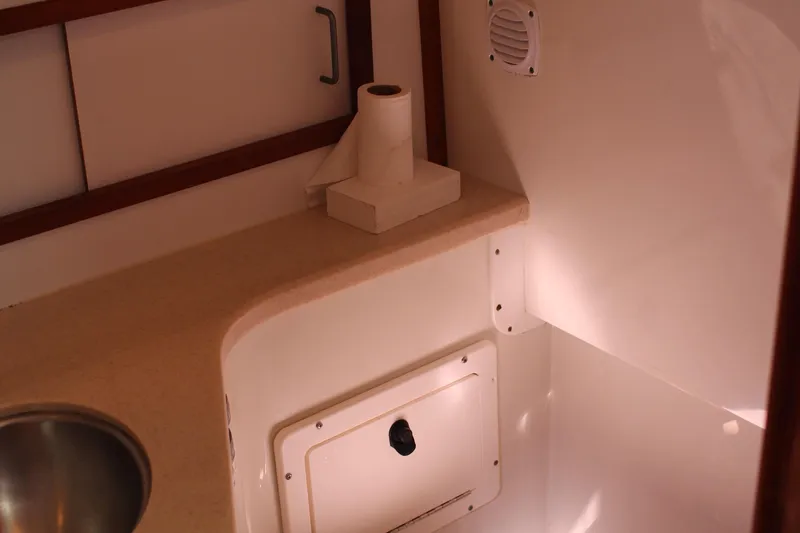  Yacht Photos Pics 2007 Back Cove 29 interior with countertop, sink, and storage compartment.