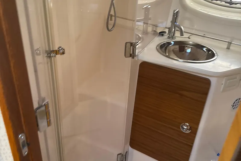 Nomad Yacht Photos Pics 2019 Tiara Yachts 39 Open bathroom with shower and sink.