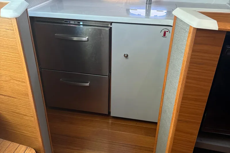 Nomad Yacht Photos Pics Interior of 2019 Tiara Yachts 39 Open, featuring stainless steel drawers and cabinetry.