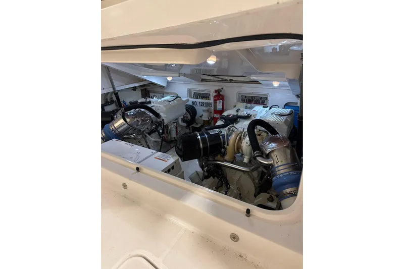 Nomad Yacht Photos Pics Engine room of 2019 Tiara Yachts 39 Open, showcasing dual engines and equipment.