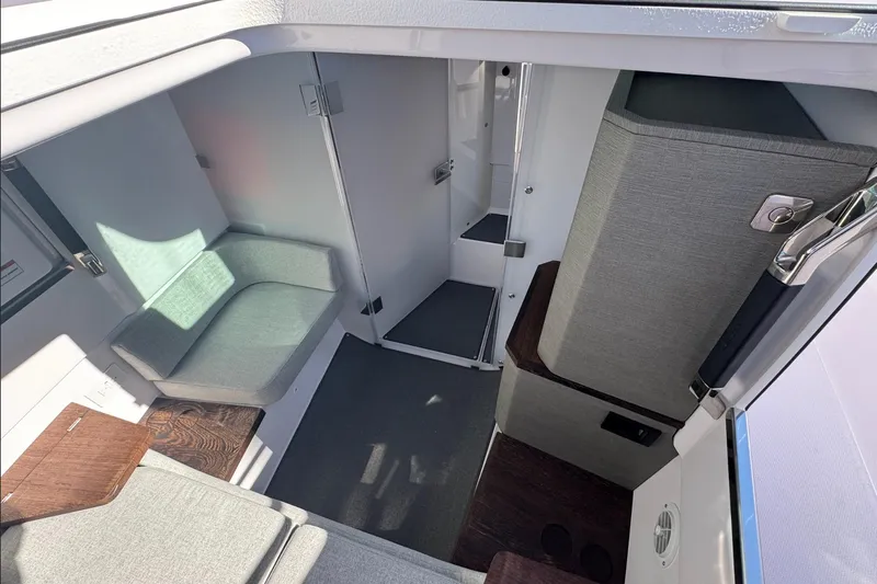  Yacht Photos Pics 2024 Axopar 37 XC CROSS CABIN interior with seating and modern design.