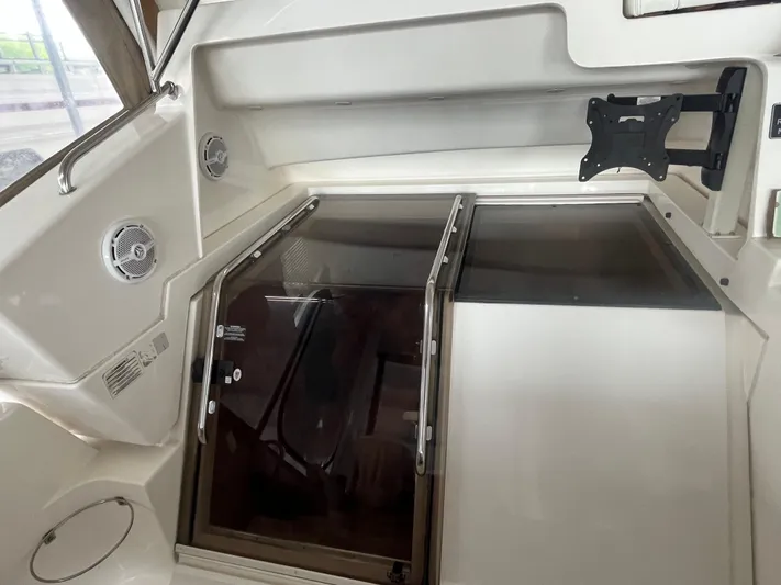  Yacht Photos Pics 1999 Silverton 392 Aft Cabin interior with hatch, speakers, and TV mount.