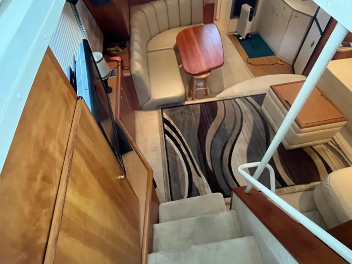  Yacht Photos Pics Interior of 1999 Silverton 392 Aft Cabin with cozy seating and modern decor.