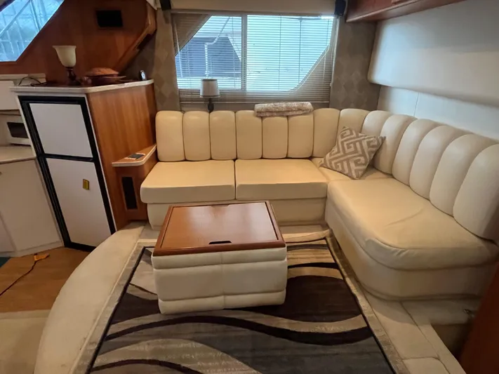  Yacht Photos Pics Luxurious interior of 1999 Silverton 392 Aft Cabin with cream leather seating and modern decor.