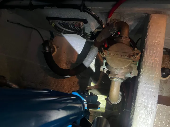  Yacht Photos Pics Engine compartment of a 1999 Silverton 392 Aft Cabin boat, showing mechanical components.