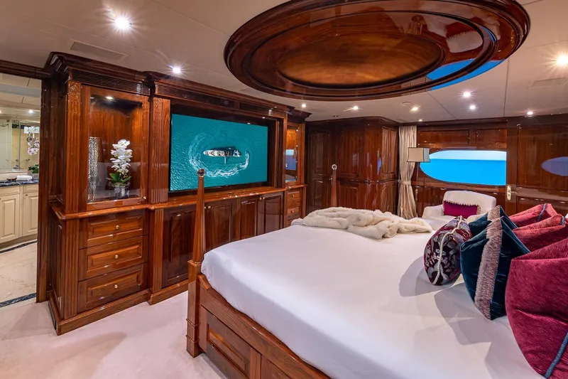 Amore Yacht Photos Pics Luxurious 2005 Christensen motor yacht bedroom with elegant wood finishes and ocean view.