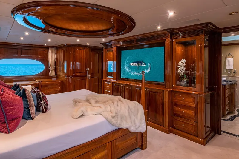 Amore Yacht Photos Pics Luxurious 2005 Christensen motor yacht bedroom with elegant wood finishes and ocean view.