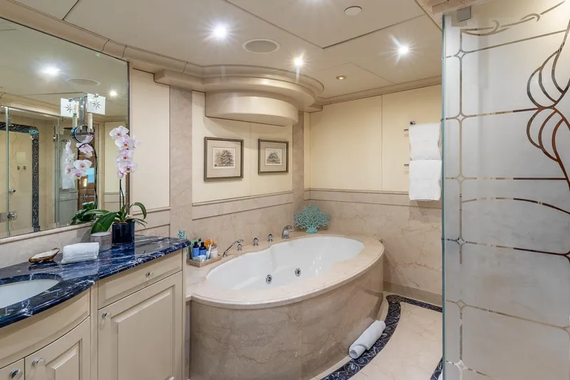 Amore Yacht Photos Pics Luxurious bathroom on 2005 Christensen Motor Yacht with elegant marble tub and stylish decor.