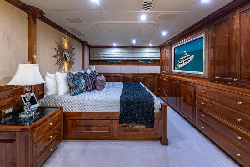 Amore Yacht Photos Pics Luxurious 2005 Christensen motor yacht bedroom with elegant wood finishes and stylish decor.