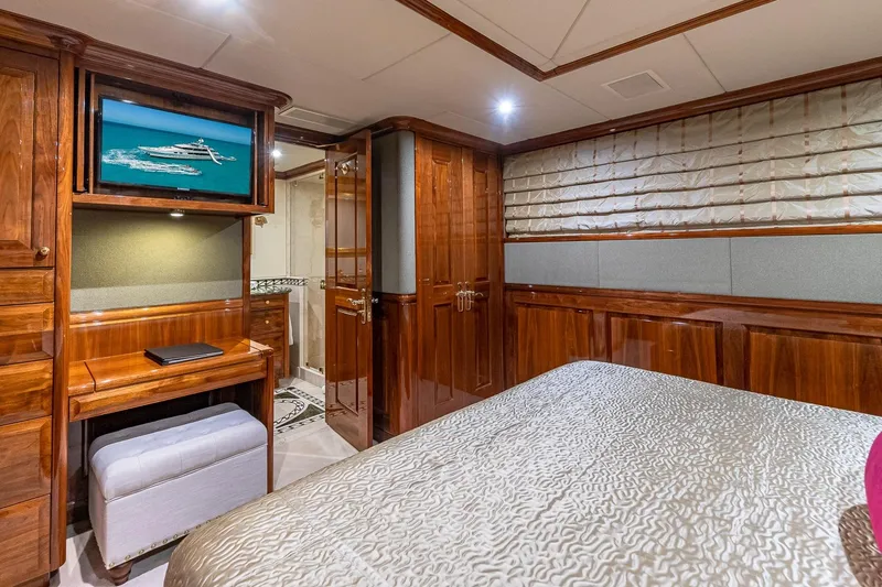 Amore Yacht Photos Pics Luxurious 2005 Christensen motor yacht bedroom with elegant wood paneling and modern amenities.