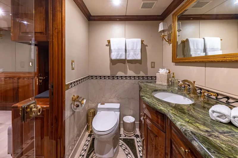 Amore Yacht Photos Pics Luxurious bathroom on 2005 Christensen Motor Yacht with marble accents and elegant fixtures.