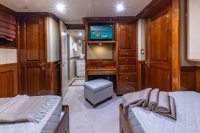 Amore Yacht Photos Pics Luxurious 2005 Christensen motor yacht cabin with elegant wood finishes and cozy twin beds.