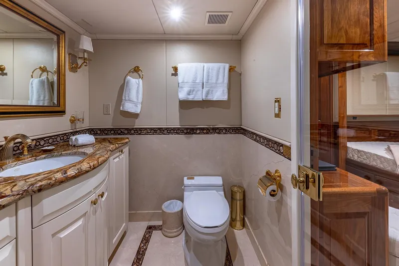 Amore Yacht Photos Pics Luxurious bathroom on 2005 Christensen motor yacht with marble countertop and elegant fixtures.