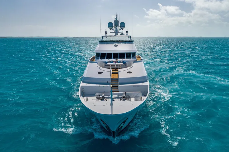 Amore Yacht Photos Pics Luxurious 2005 Christensen motor yacht cruising on vibrant blue ocean waters.