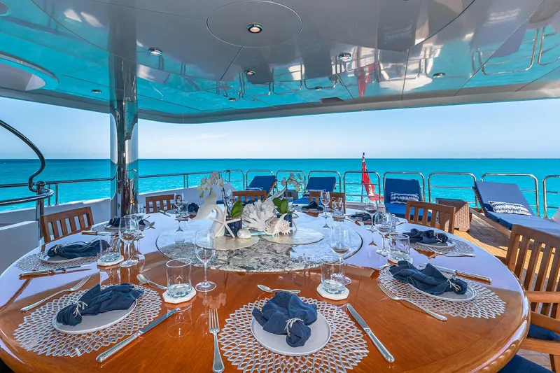 Amore Yacht Photos Pics Luxurious dining setup on 2005 Christensen motor yacht with ocean view.