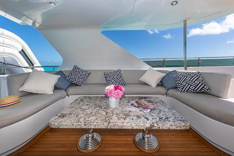 Amore Yacht Photos Pics Luxurious 2005 Christensen motor yacht deck with elegant seating and marble table.